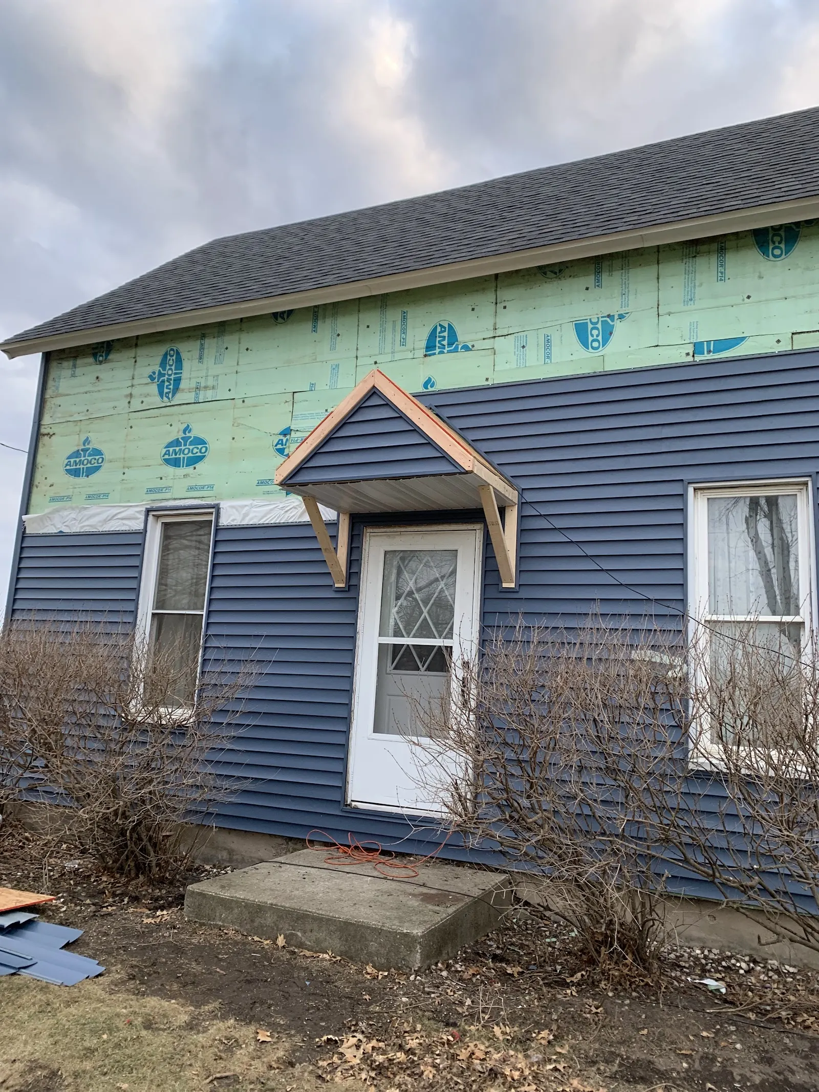 House wrap going on before new siding