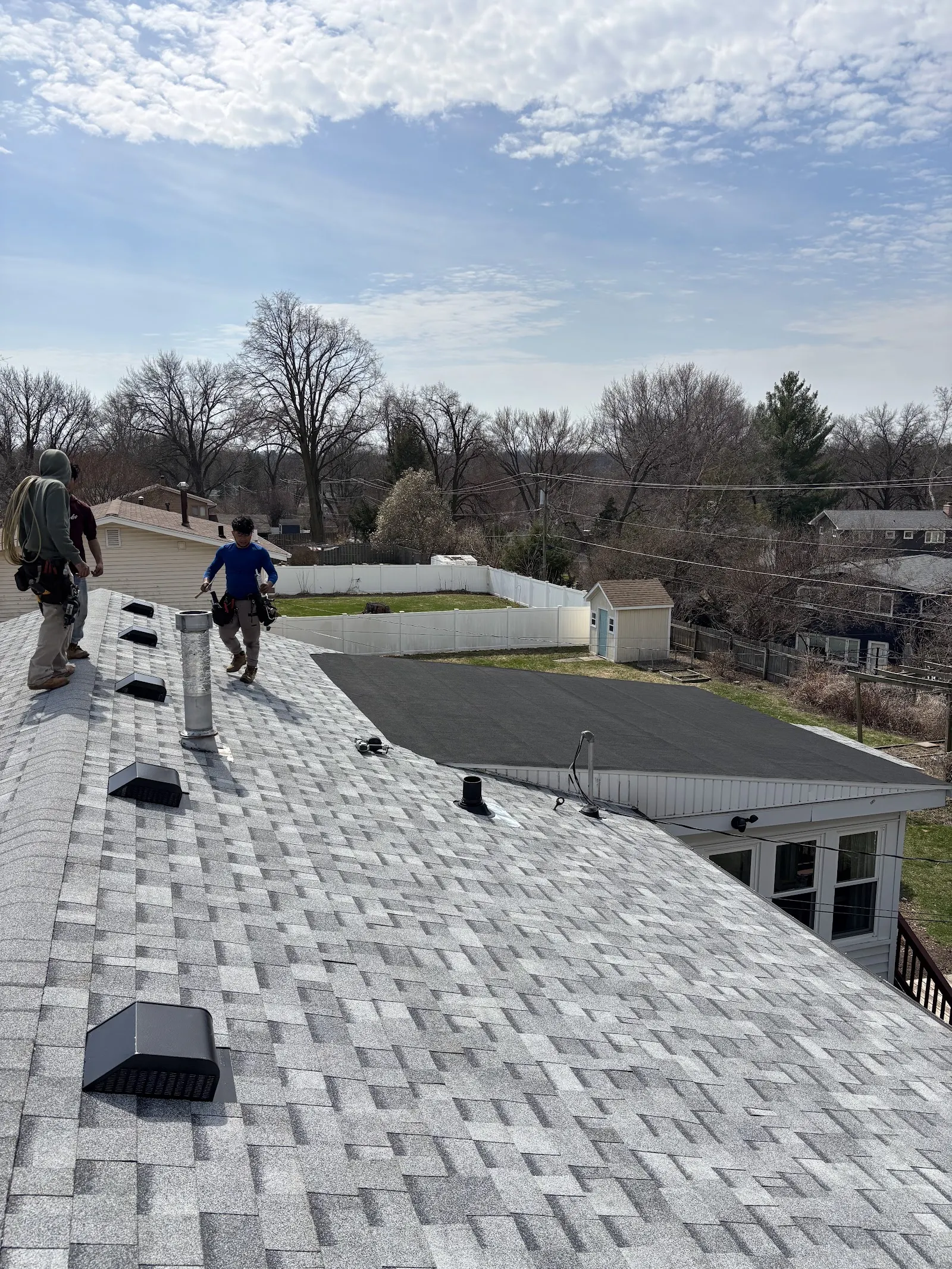 Hugaert Roofing crew installing a new shingle roof